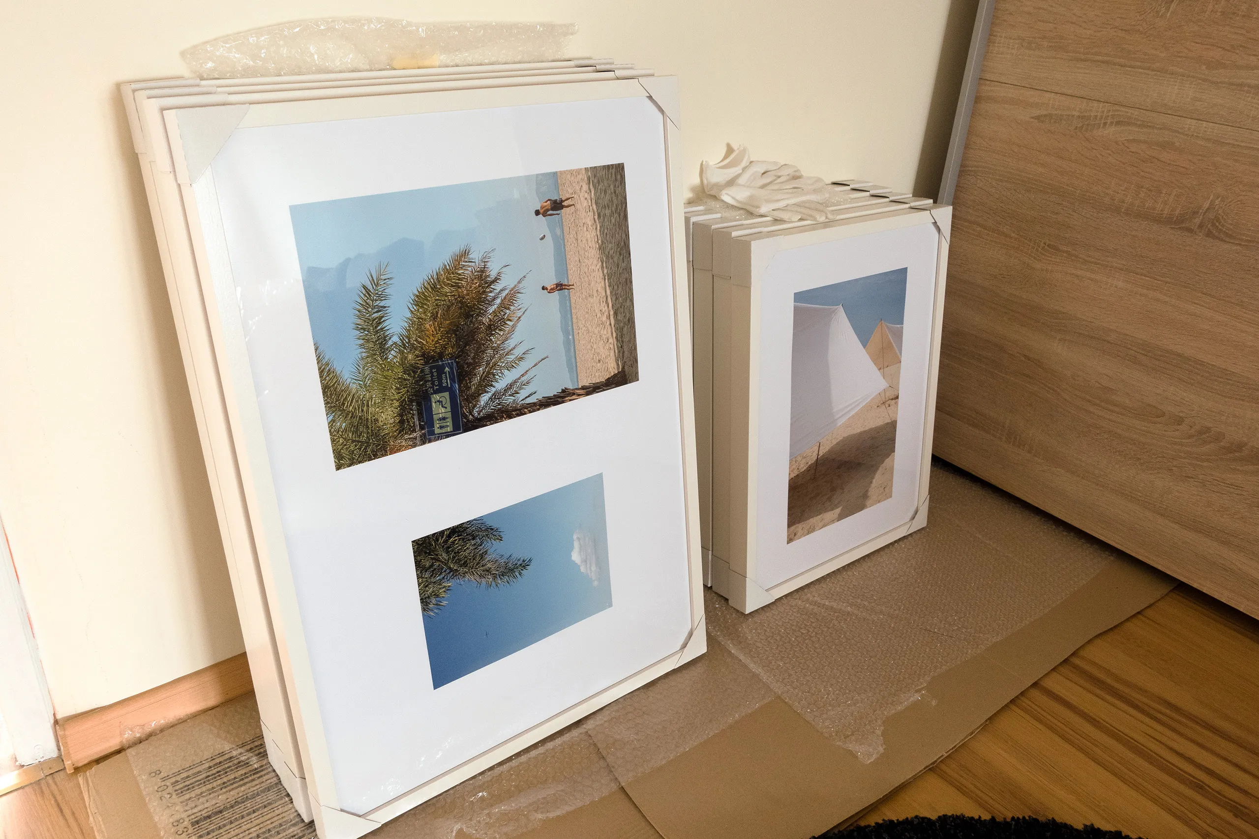 Citramarine — installation in progress, framing prints, RANDOM Gallery 2024