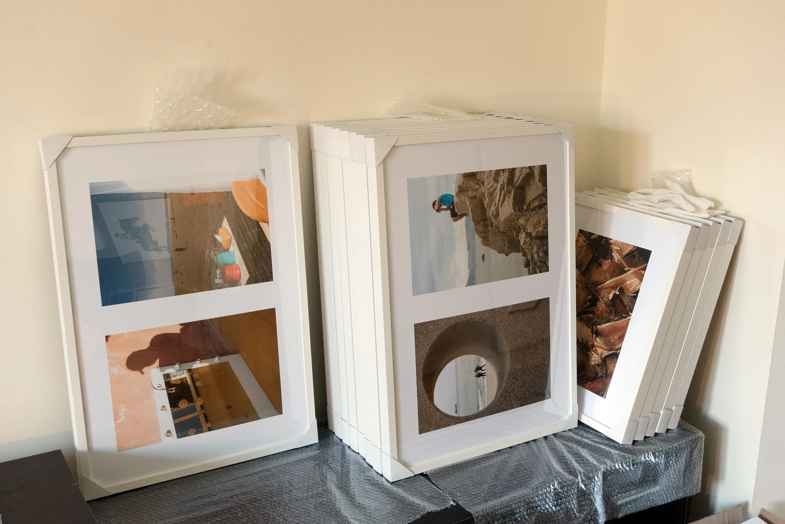 Citramarine — installation in progress, framing prints, RANDOM Gallery 2024