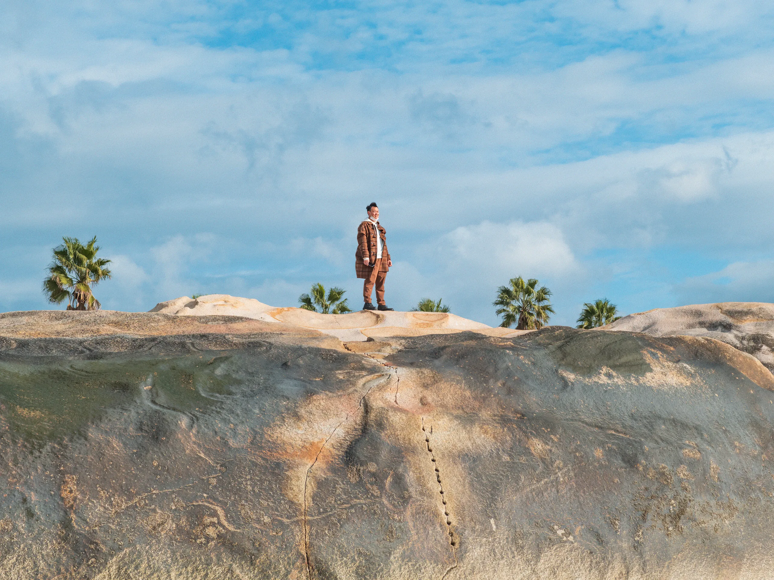 The Strip: Staying Afloat — swimming in the sea off Xiamen beach, photograph by Andras Ikladi