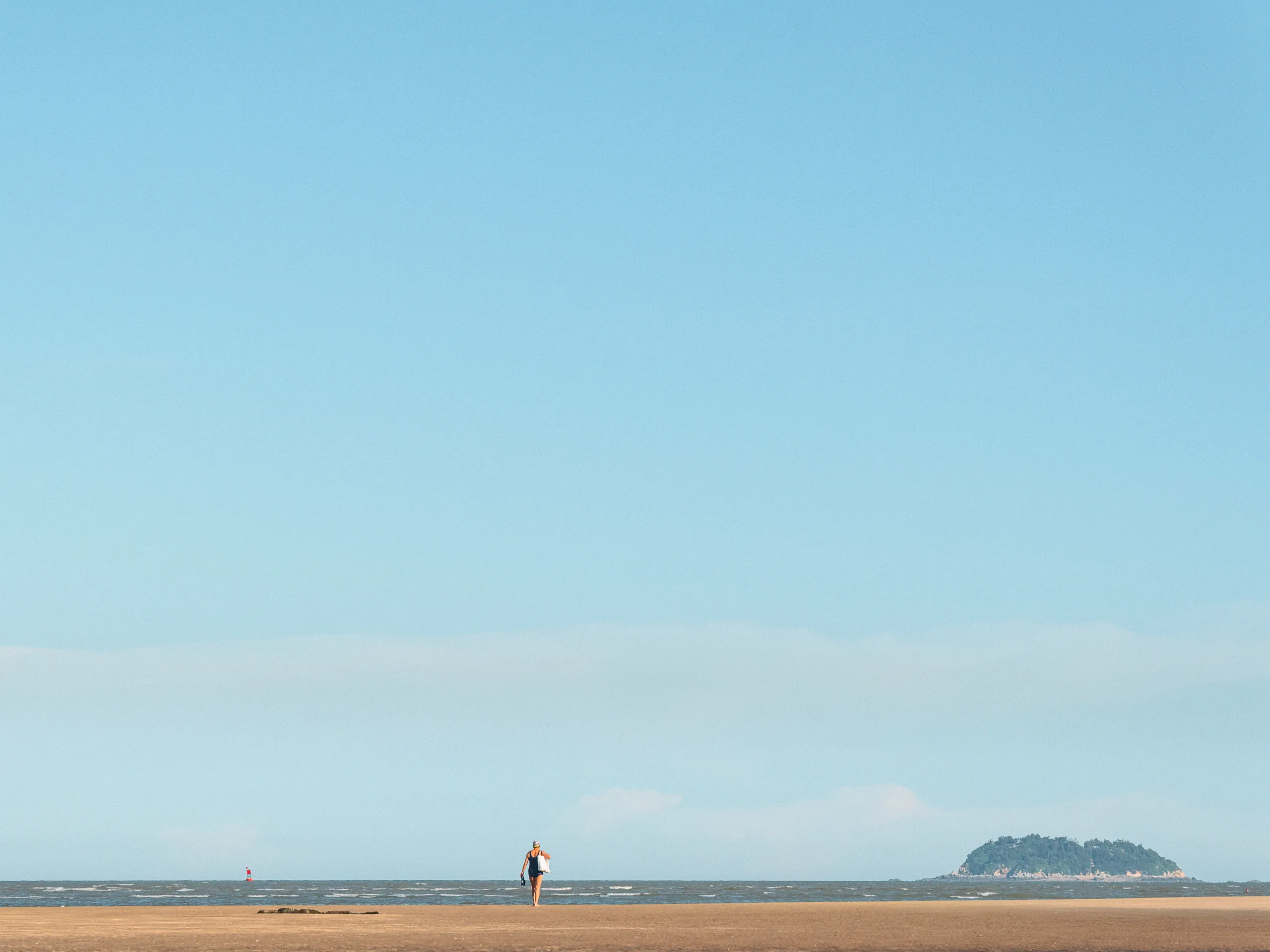 The Strip: On Temporary Grounds — tidal flats under a bridge in Xiamen, photograph by Andras Ikladi
